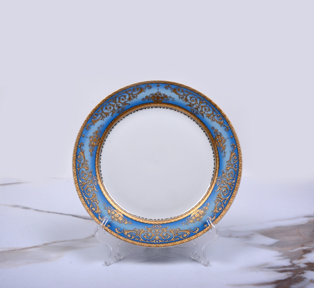 A gold and blue porcelain dinner set